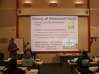 showing slide of history of denial