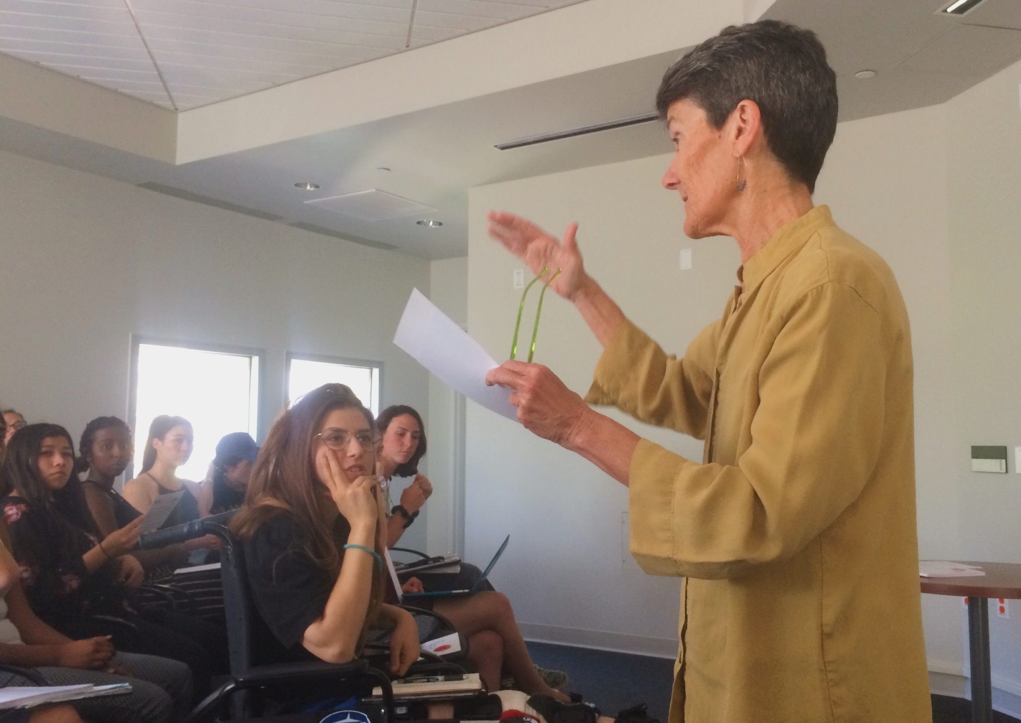 Professor lectures to students in a room