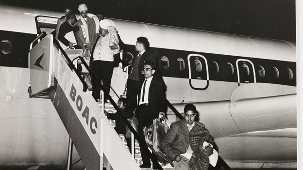 black and white image of people deplaning from BOAC airplane