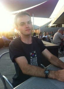 Chris McQuilkin at table in food courtyard area