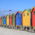 a row of colorful houses on the beach