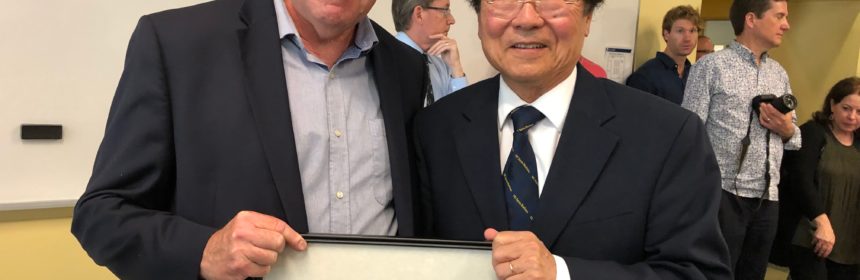 Professor Nelson Lichtenstein Given Top Honor pictured with another person and people mill about in the background