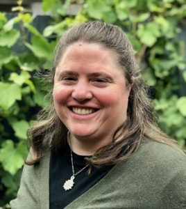 Melissa J. Barthelemy headshot with greenery in background