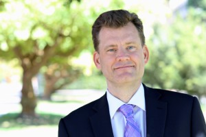 John Majewski headshot in front of trees