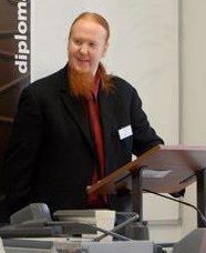 Henry Maar at a podium speaking