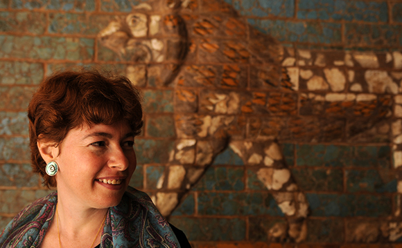 Orit Bashkin in front of tile mural