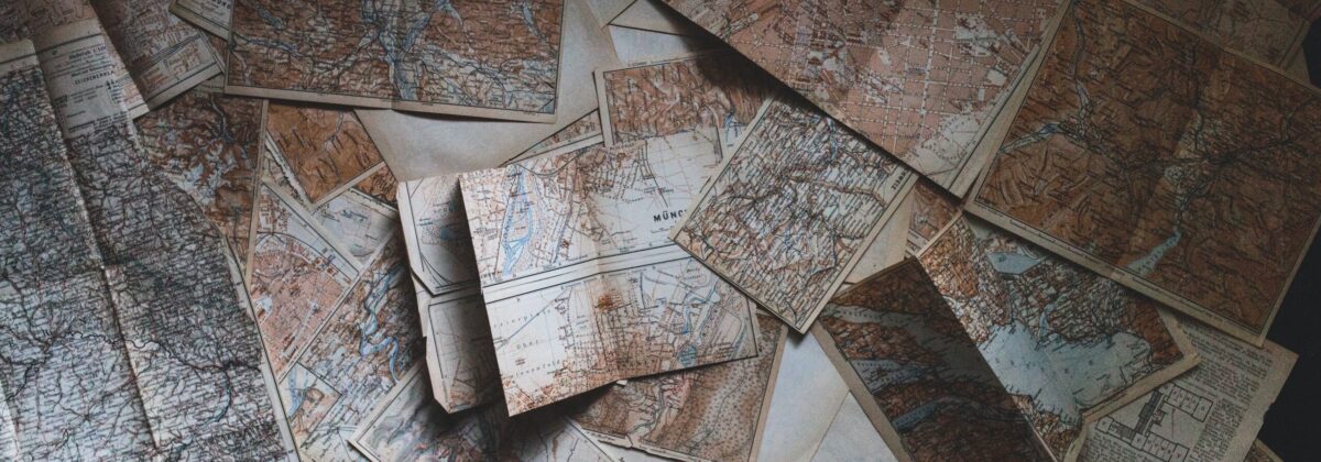 a stack of maps in a dimly lit room