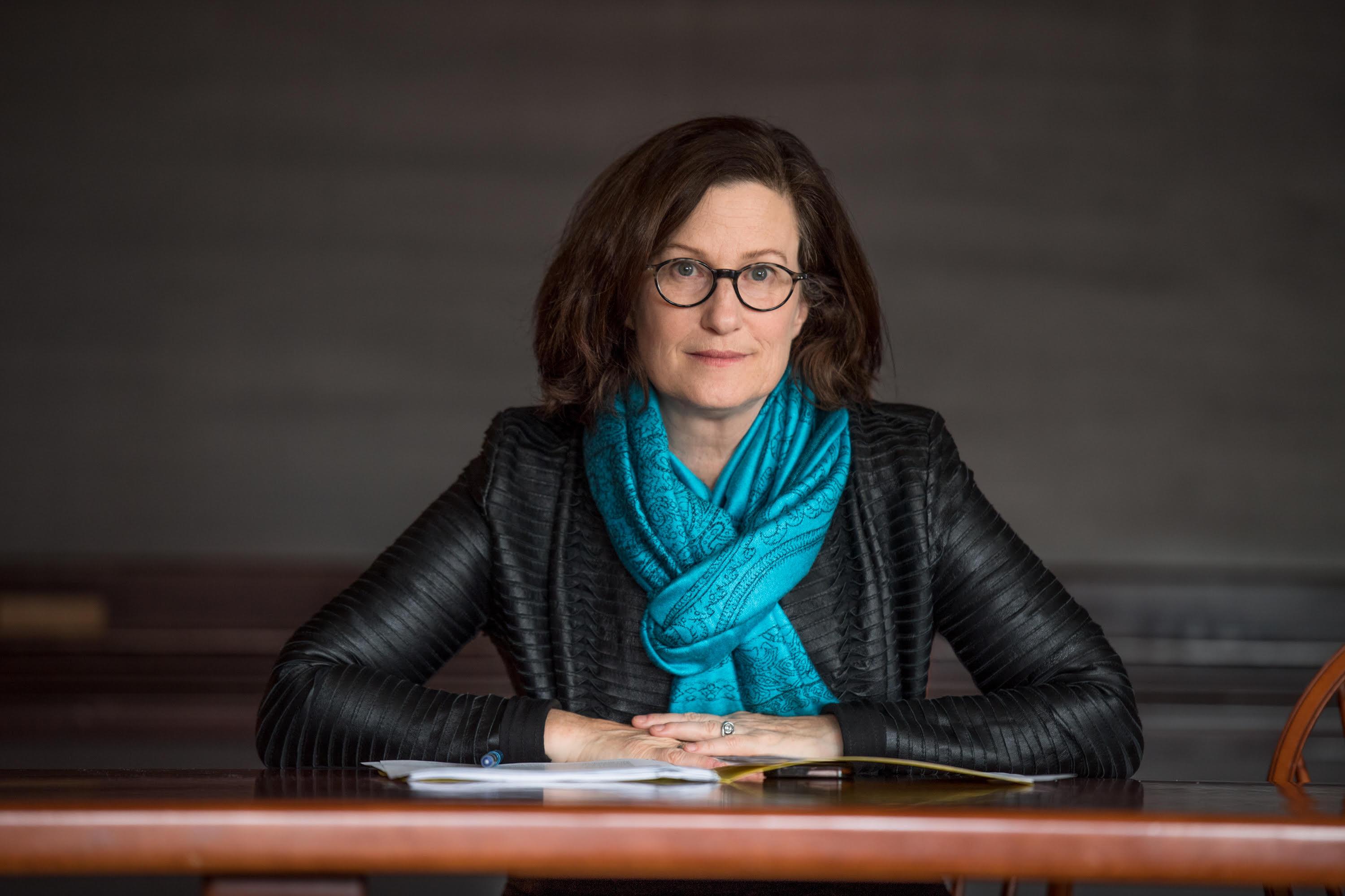 Bonnie Honig sitting at a table