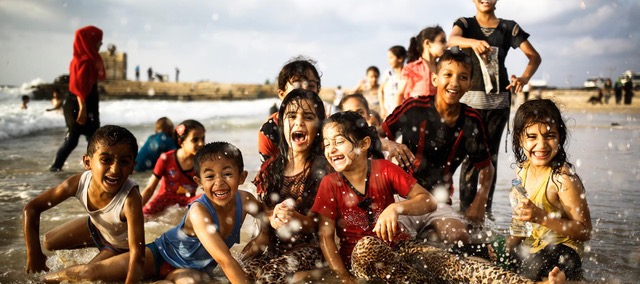 numerous children playing water