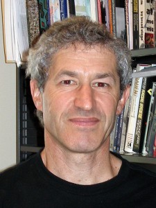 Harold Marcuse with bookcase filled with books in background