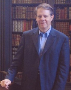 Stephen Humphreys in front of bookcase filled with books