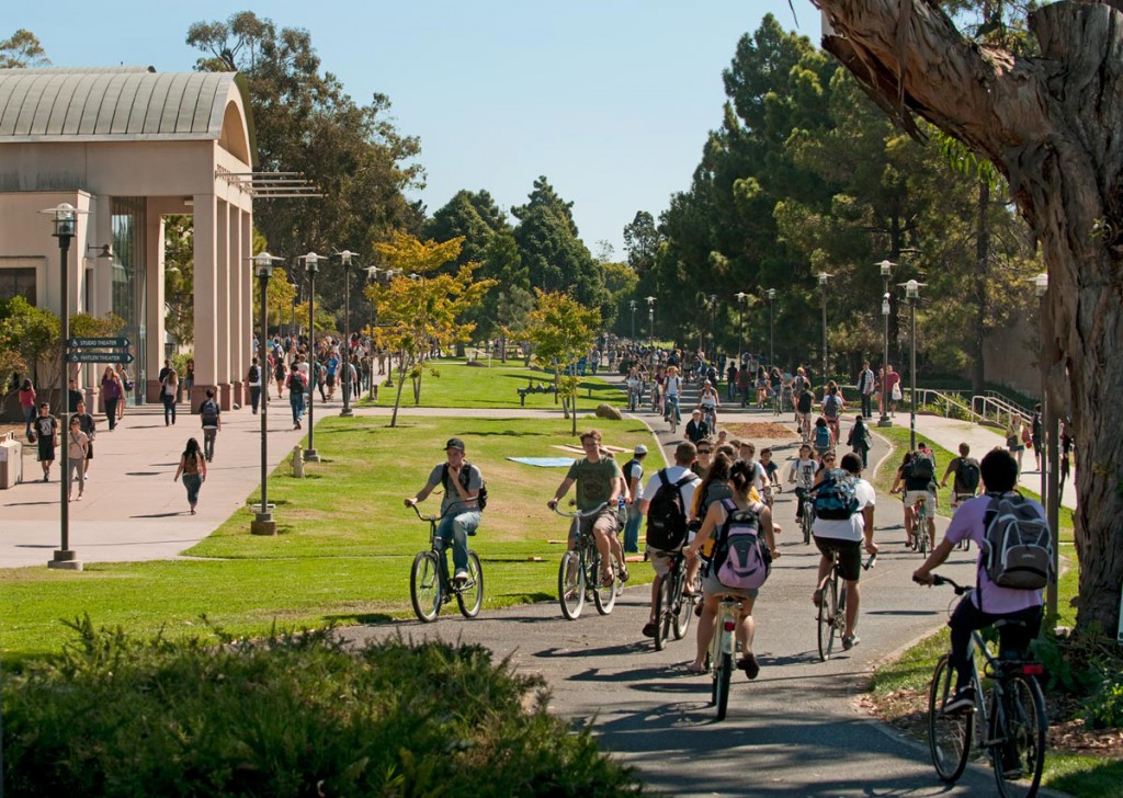 Photo of UCSB's bustling campus bike path near HSSB Building.